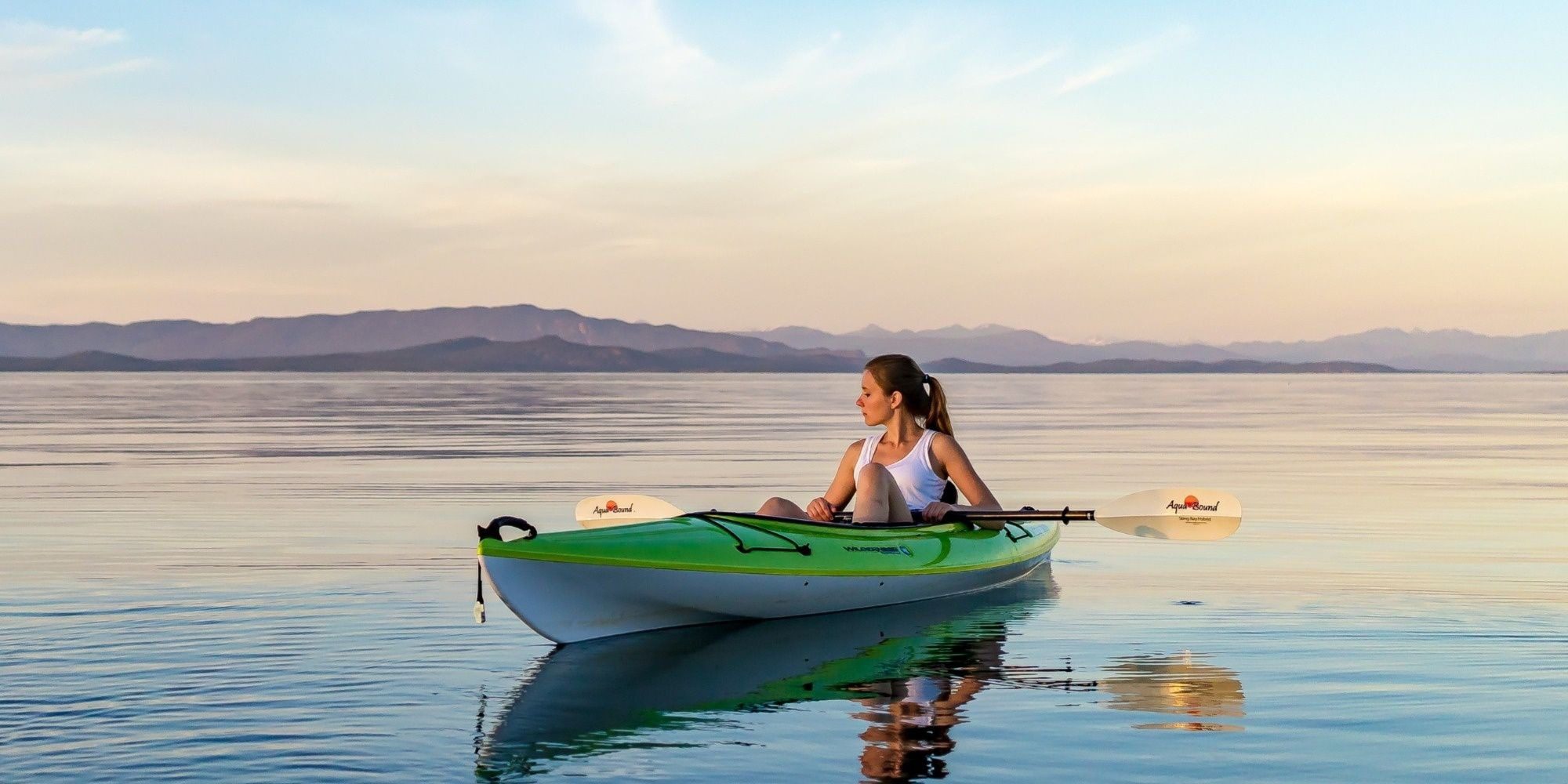 girl-kayaking-in-ocean