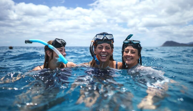 Girls are Snorkelling in the ocean