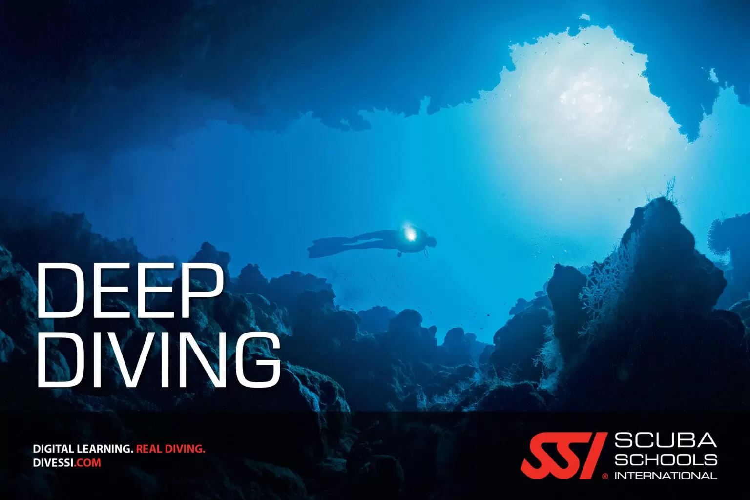 A diver diving into the depth of the sea with a torch light in hand text highlights "SSI deep diving"