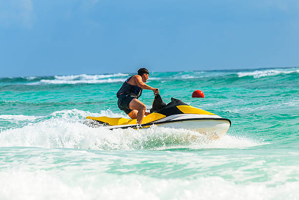 A man doing Jet ski ride in transparent blue waters of andaman sea.